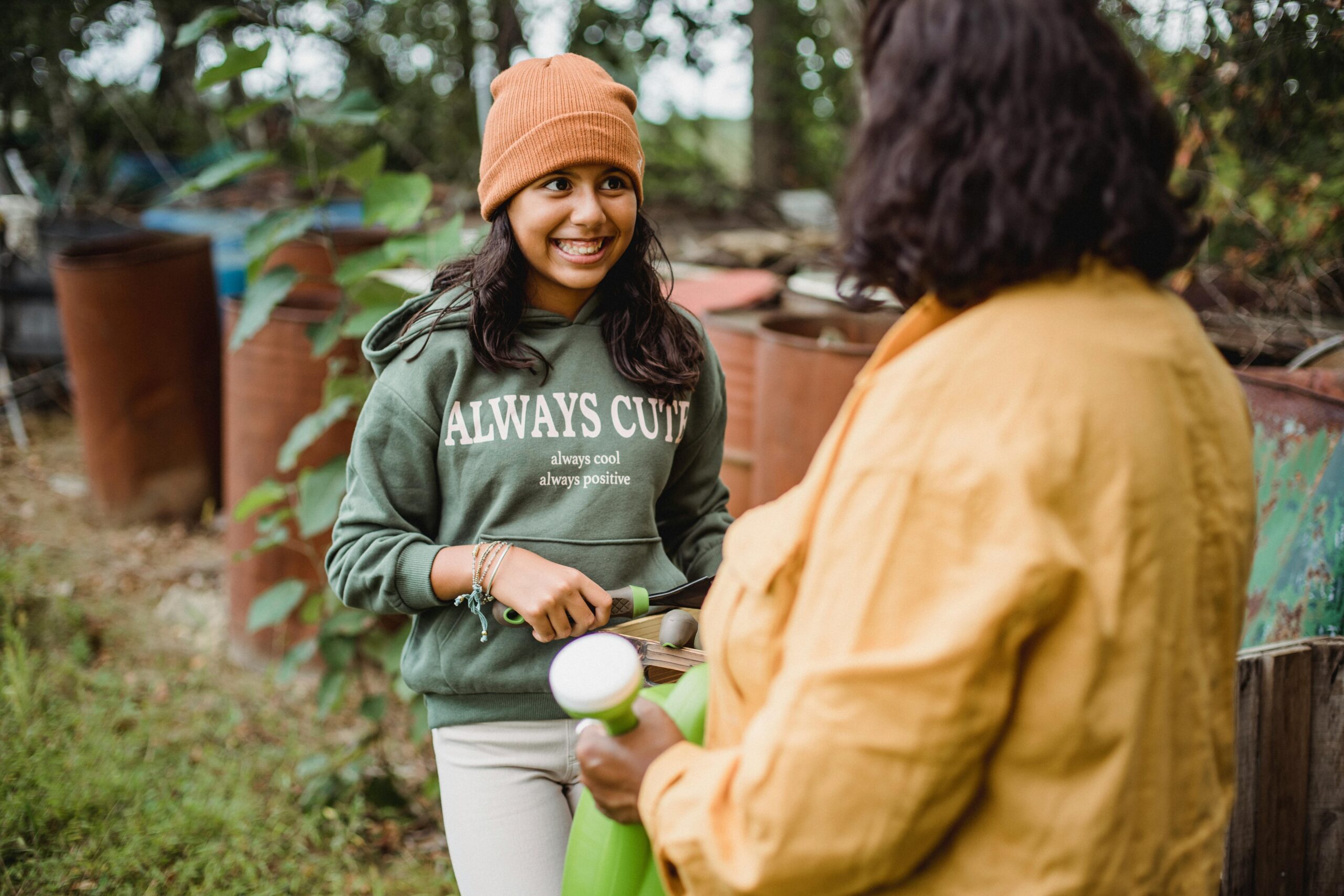 Photo by Zen Chung: https://www.pexels.com/photo/faceless-farmer-speaking-with-positive-ethnic-daughter-near-barrels-5529955/